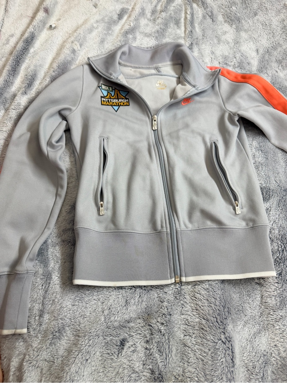 Nike Kids Light Gray Zip Jacket with Orange Shoulder Stripe
